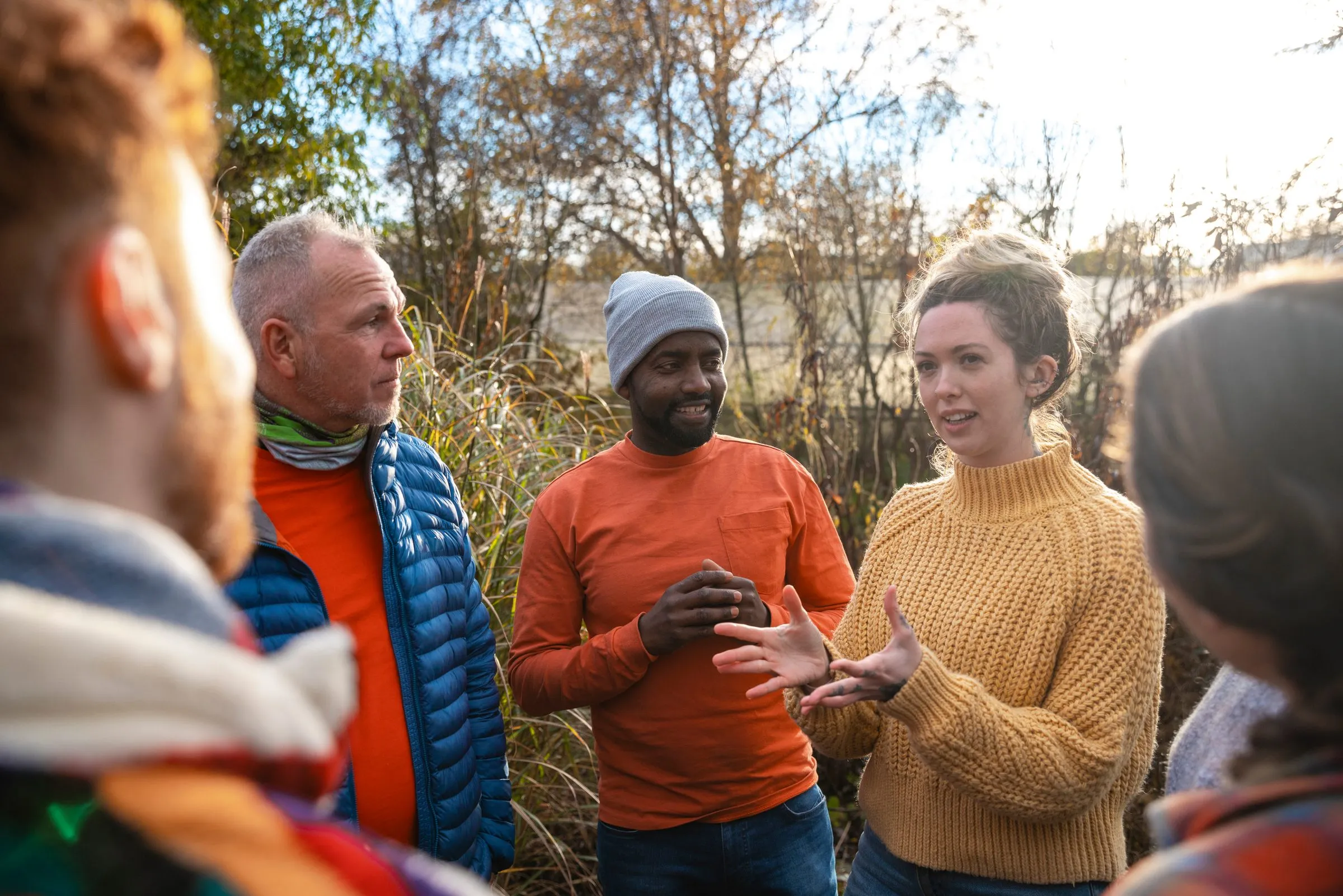 Volunteers talk together outdoors